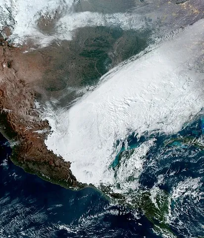 blizzard: a large snowstorm accompanied by strong winds and greatly reduced visibility caused by blowing snow