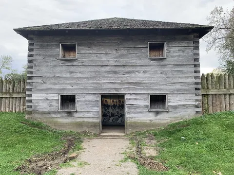 blockhouse: a sturdy military fortification, often of concrete, with gunports