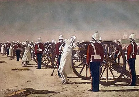 blow from a gun: to execute by tying against the muzzle of a loaded cannon, which is then fired