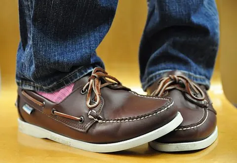 boat shoe: a type of casual footwear resembling a loafer, originally designed to be worn aboard a boat,...