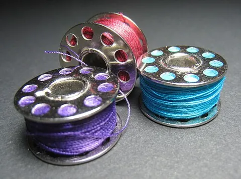 bobbin: a spool or cylinder around which wire is coiled