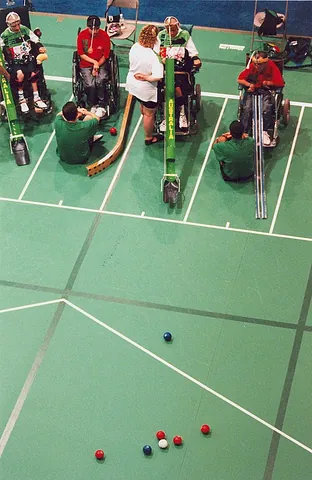 boccia: a sport, similar to bocce, designed to be played by people with impaired motor skills
