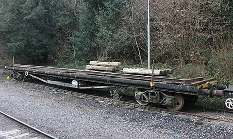 bogie bolster wagon: a long flat wagon mounted on two four-wheel bogies, with transverse baulks of timber (bolsters)...
