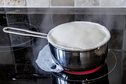 boil over: to boil to such an extent as to overflow its container