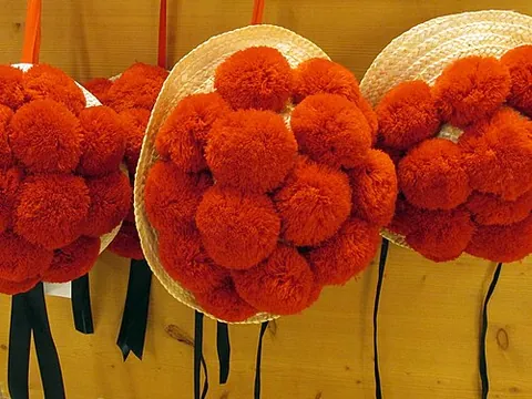 bollenhut: a formal headdress with woollen pompoms, worn since about 1750 by Protestant women as part of their...