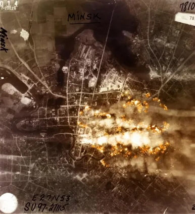 bombardment: the act of bombing, especially towns or cities
