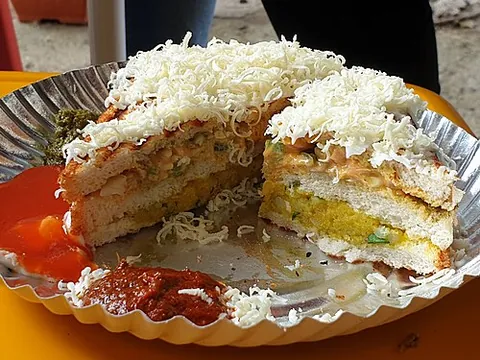 bombay sandwich: a sandwich made of white bread covered in butter and chutney with a filling of potatoes and raw...