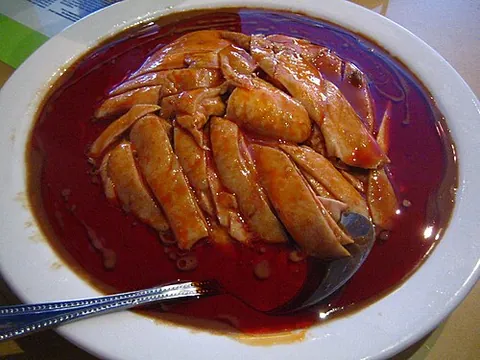 bon bon chicken: a Chinese dish of sliced chicken in a spicy sauce with onions and other ingredients