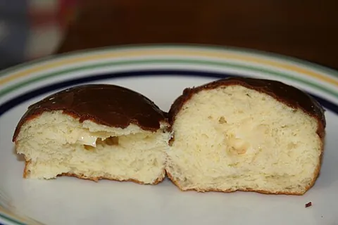 boston cream donut: a round deep-fried pastry that is traditionally filled with vanilla custard and glazed in milk...
