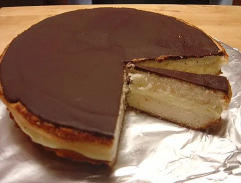 boston cream pie: a round cake that is split, filled with custard or cream, and frosted with chocolate, the official...