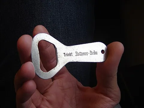 bottle opener: a device used to remove the cap from a bottle