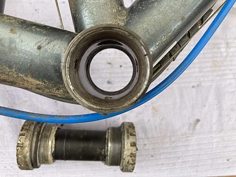 bottom bracket: a bicycle part that connects the crankset (chainset) to the frame and allows the crankset to rotate...