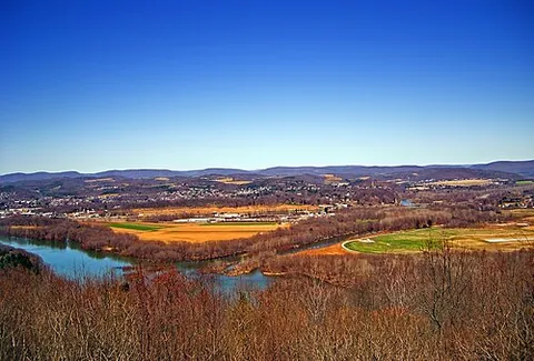 bottomland: flat land along a river, lying a few feet above normal high water, naturally fertile, and often...