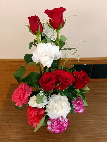 bouquet: an arrangement or bunch of cut flowers; a nosegay