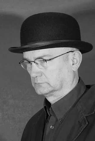 bowler hat: a hard round black felt hat with a narrow brim, formerly worn by men