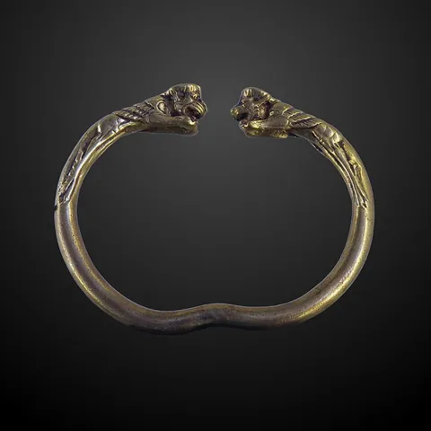 bracelet: a band or chain worn around the wrist as jewelry/jewellery or an ornament