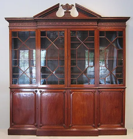 breakfront: any piece of furniture (especially a bookcase or cabinet) that has a central section that projects...