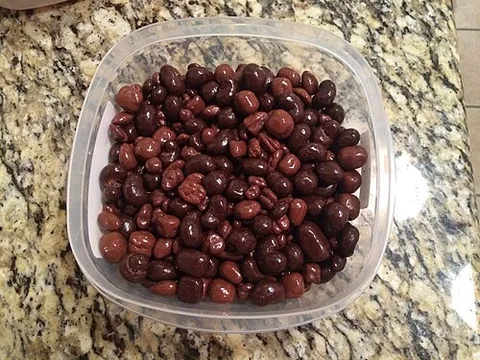 bridge mix: a mixture of snacks consisting of nuts, fruits, and chocolate-covered cremes