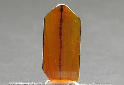 brookite: a dark brown mineral form of titanium dioxide, with the chemical formula TiO₂