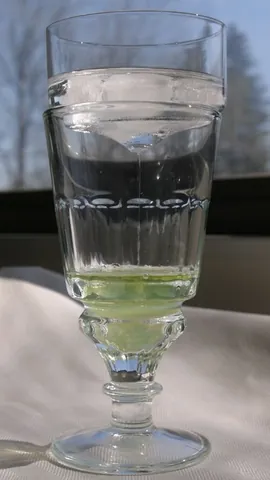 brouilleur: a lid- or bowl-like device used in preparing absinthe, allowing water to trickle gradually into the...