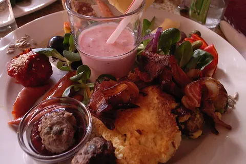 brunch: a meal eaten later in the day than breakfast and earlier than lunch, often in a leisurely, festive,...