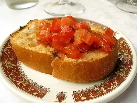 bruschetta: a light Italian dish of toasted bread with a topping of olive oil, garlic and chopped tomatoes