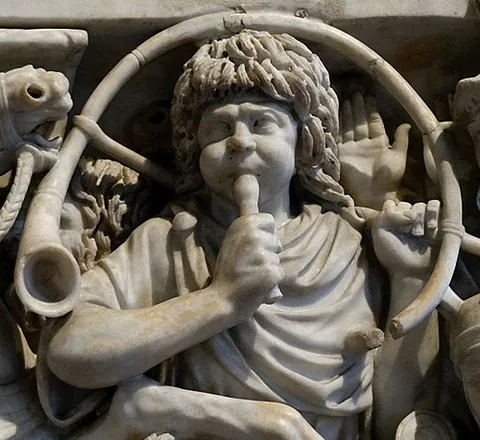 buccina: a curved brass instrument used by the Ancient Roman army
