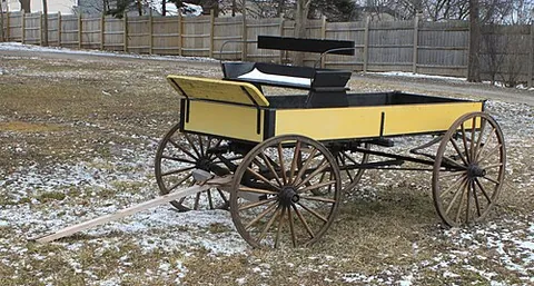 buckboard: a simple, distinctively American four-wheeled horse-drawn wagon designed for personal transport as...