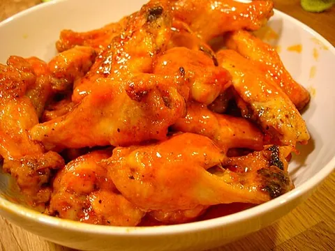 buffalo wing: a snack made of an unbreaded, fried chicken wing coated in spicy sauce