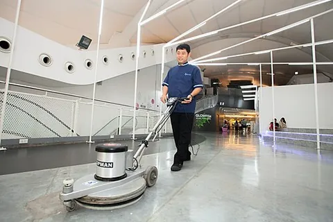 buffer: a machine with rotary brushes, passed over a hard floor to clean it