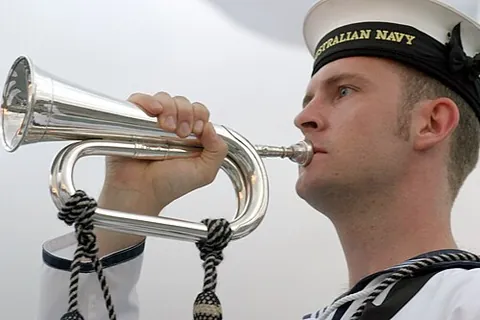 bugler: someone who plays a bugle