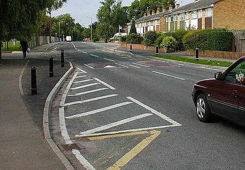 bulb-out: a traffic calming measure that widens the sidewalk for a short distance