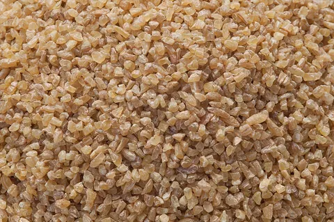 bulgur: wheat grains that have been steamed, dried, and crushed; a staple of Middle Eastern cooking