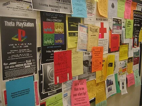 bulletin board: a board on which messages may be posted, especially one in a public space