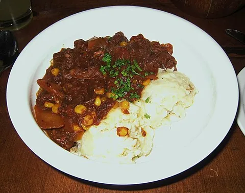 burgoo: a dish which originated among seafarers during the days of sail: a sort of porridge seasoned with...