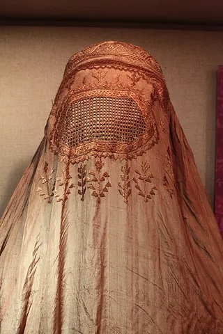 burqa: an enveloping Central Asian garment which covers the whole body, incorporating a netted screen to...