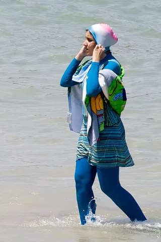 burqini: a head-to-toe swimsuit, enabling women to conform to the Islamic dress code when bathing on a...