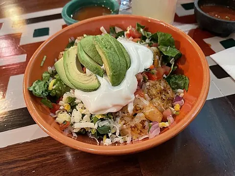 burrito bowl: a dish consisting of various typical burrito ingredients, especially rice, beans, salta, and...