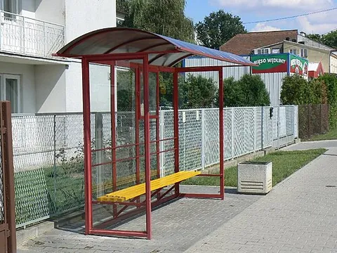 bus stop: a place where public transport buses stop to allow passengers to board or leave