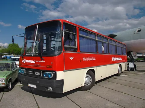 bus: a motor vehicle for transporting large numbers of people along roads