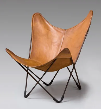 butterfly chair: a type of chair featuring a metal frame, bearing resemblance to a butterfly's wings, and a large...
