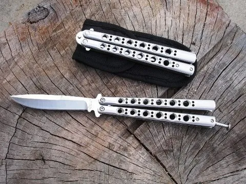 butterfly knife: a folding pocket knife with two handles counter-rotating around the tang such that, when closed,...