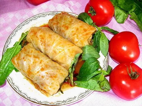 cabbage roll: a dish consisting of cooked cabbage leaves wrapped around a variety of fillings
