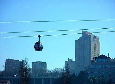 cable car: a streetcar moved by gripping to rotating loop of cable running along the track