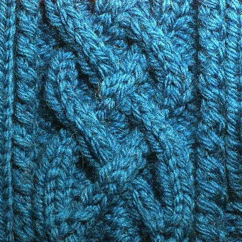 cable stitch: a fancy type of knitting stitch that creates the effect of a braided or twisted rope