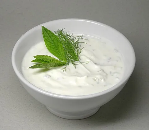 cacik: a Turkish dish made from yoghurt, salt, olive oil, crushed garlic, chopped cucumber, and mint