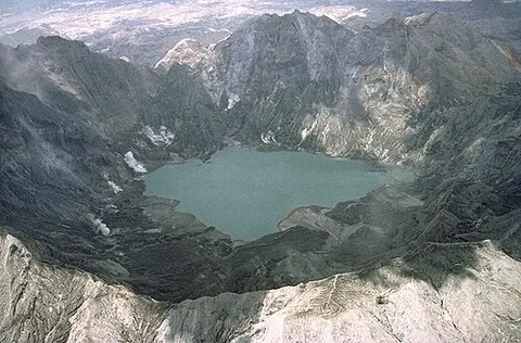 caldera: a large crater formed by collapse of the cone or edifice of a volcano