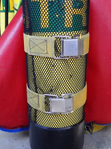 cam band: a combination of webbing strap and cam action buckle used to hold on an air cylinder in scuba diving