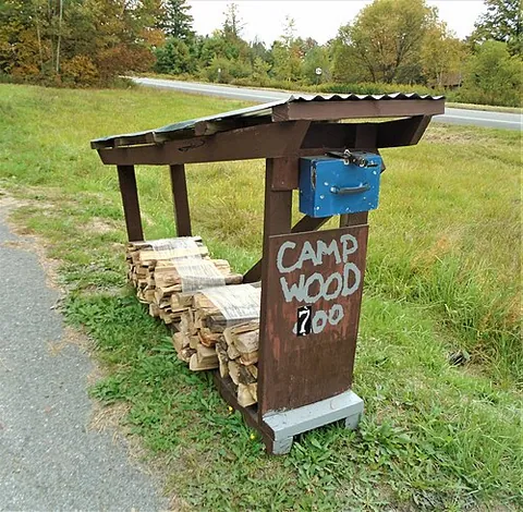 camp wood: a type of firewood sold at roadside stands for use in camping, campfires, or cabins, that provides...