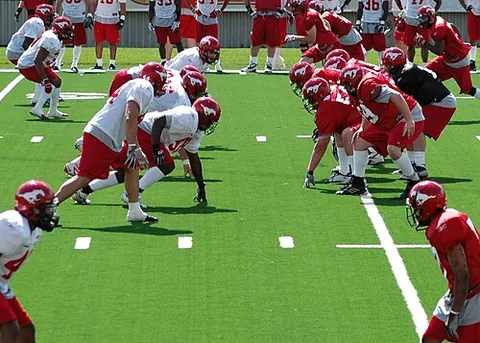 canadian football: a game similar to American football played on a field of 110 yards long and 65 yards wide (with two...